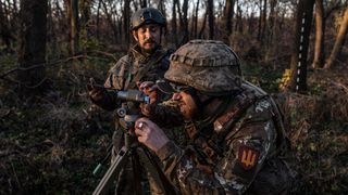 Ukrainian soldiers direct artillery in the direction of Bakhmut